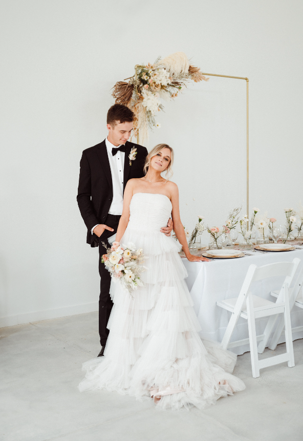 A classic yet modern bride and groom showcase a boho vibe at The Monroe on 415th wedding venue in McMinnville, TN located near Nashville. 