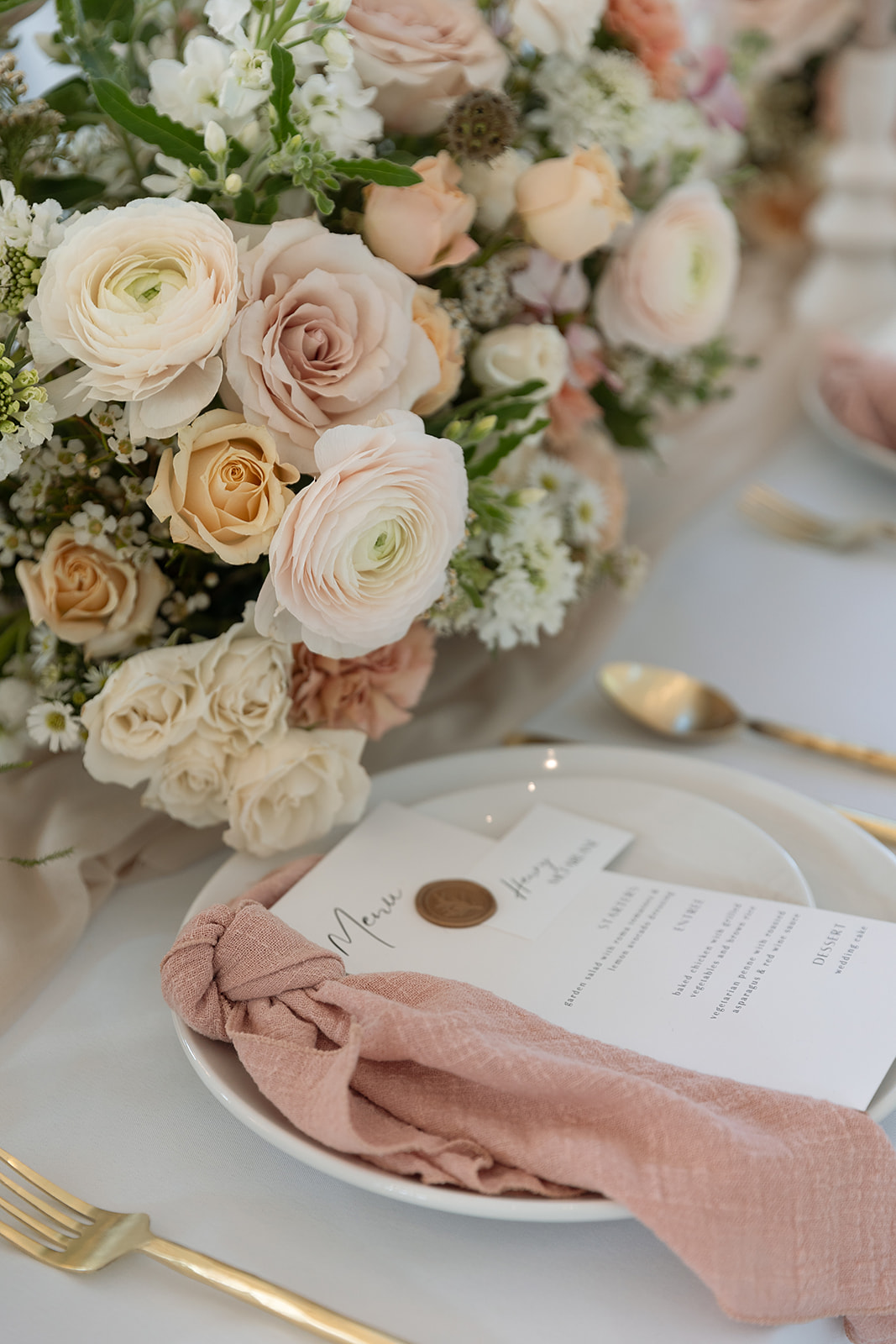 pink wedding table decor with dinner menu and napkin