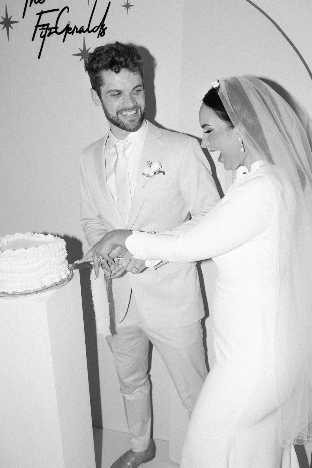 happy wedding couple cutting trendy cake