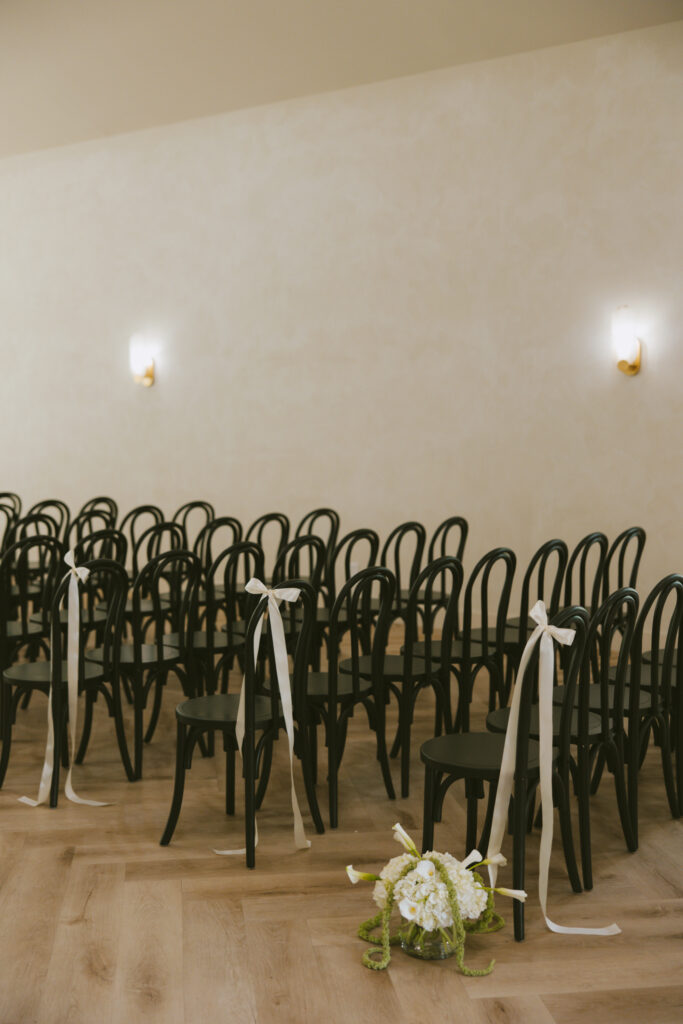black arched chairs in the chapel