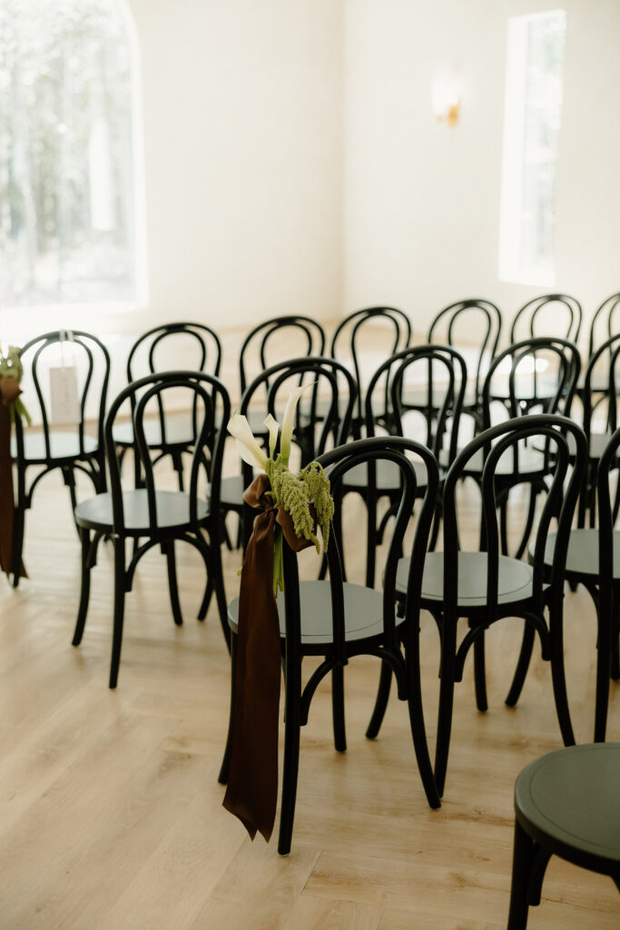 Black ceremony chairs in The Chapel at The Monroe on 415th